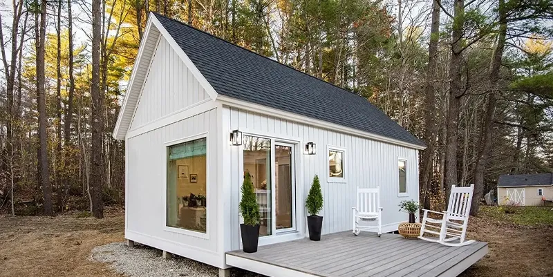 Custom-built detached Accessory Dwelling Unit (ADU) in a Boston Metrowest backyard, featuring modern siding and large windows.